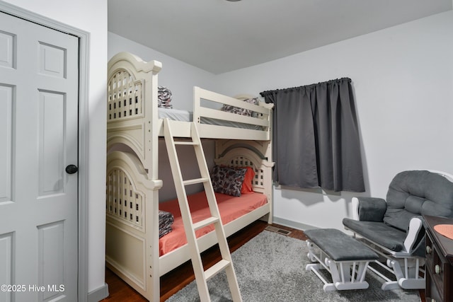 bedroom featuring wood finished floors