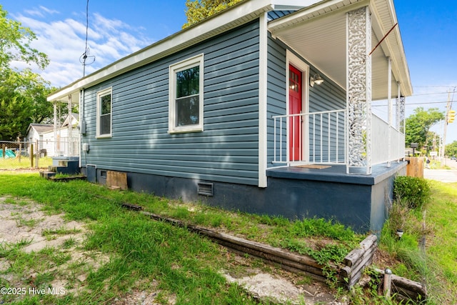 view of home's exterior featuring fence