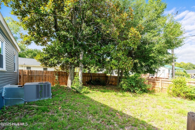 view of yard with central AC unit