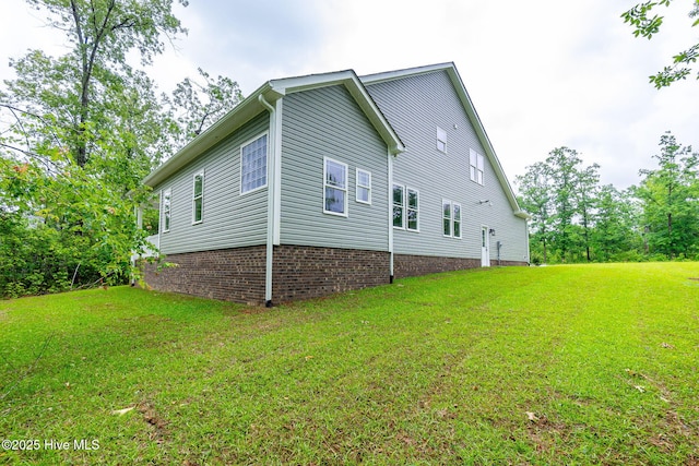 view of home's exterior featuring a yard