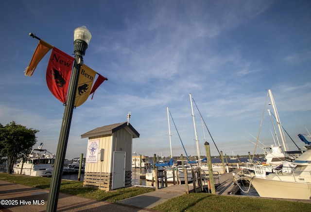 view of property's community with a dock
