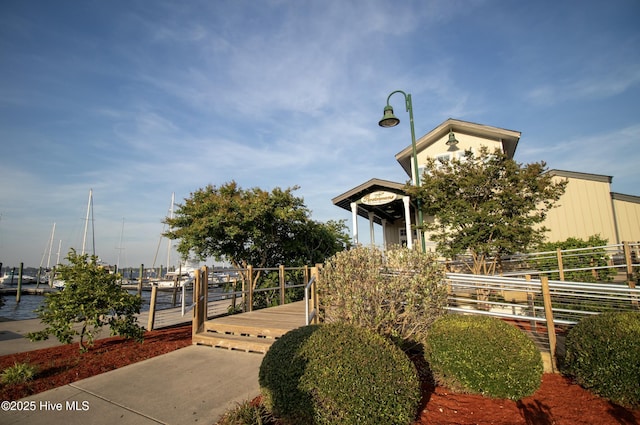 view of community featuring fence