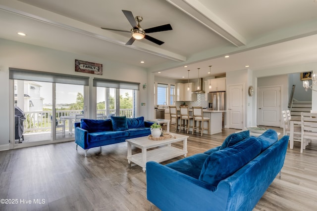 145 Whispering Pine Ln, Holly Ridge, NC 28445 - living area with beamed ceiling, recessed lighting, ceiling fan, light wood-style floors, and stairway