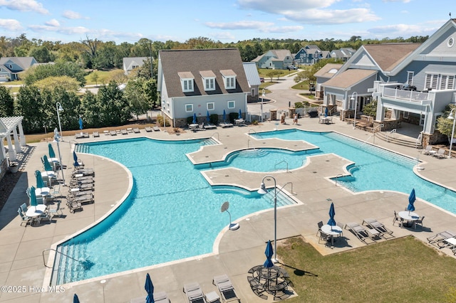 145 Whispering Pine Ln, Holly Ridge, NC 28445 - community pool with a patio area and a residential view