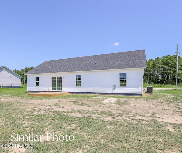 128 Buckskin Dr, Pollocksville, NC 28573 - rear view of property featuring a yard