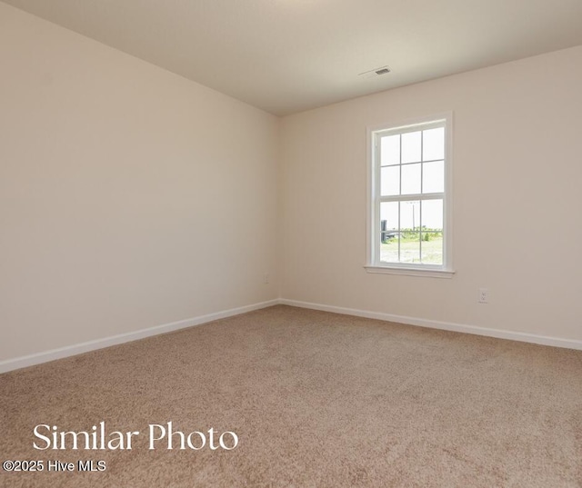 128 Buckskin Dr, Pollocksville, NC 28573 - carpeted spare room with baseboards