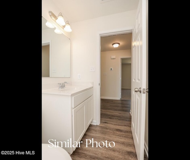128 Buckskin Dr, Pollocksville, NC 28573 - half bathroom with vanity and wood finished floors