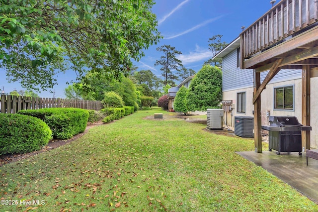view of yard with central AC