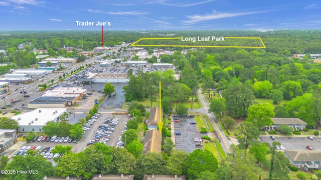 aerial overview of property's location featuring property parcel outlined and a forest