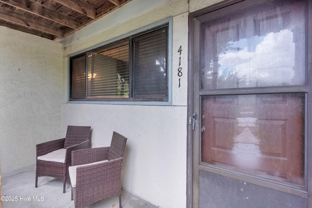 view of exterior entry with stucco siding