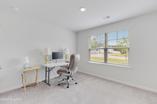 office space with carpet floors and baseboards