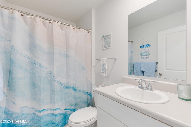 full bathroom with vanity, toilet, and a shower with curtain