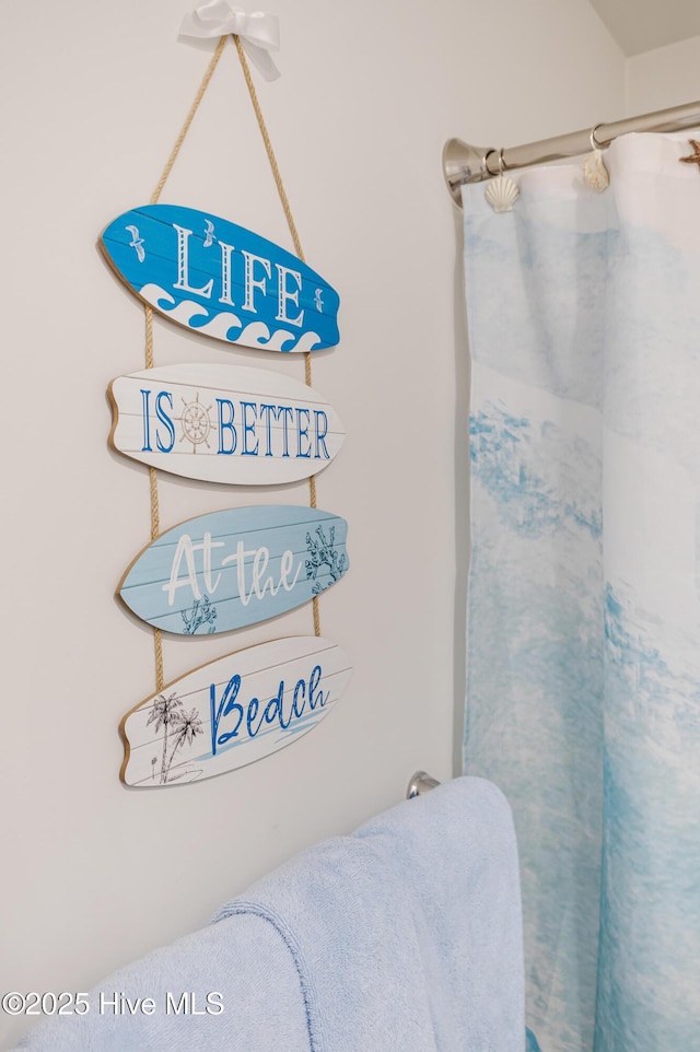 bathroom view of a shower with curtain