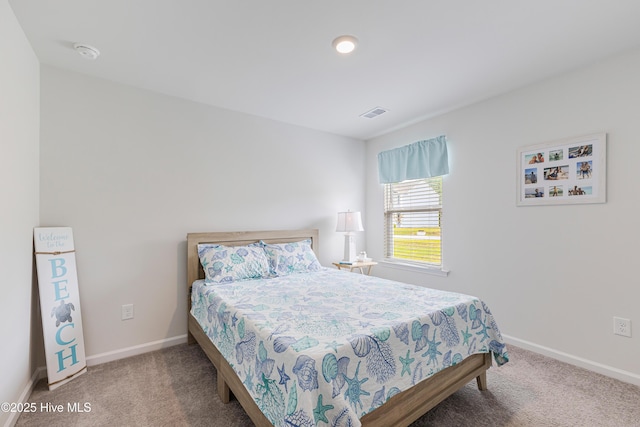 bedroom featuring carpet floors and baseboards