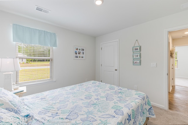 carpeted bedroom with baseboards and recessed lighting