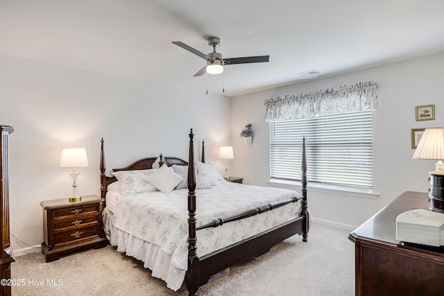 bedroom with baseboards, light carpet, and a ceiling fan