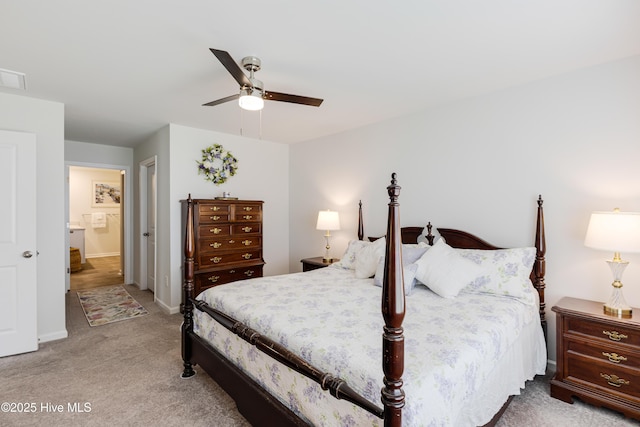 bedroom featuring carpet floors, baseboards, a ceiling fan, and connected bathroom