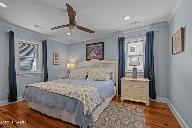 141 Bayview Blvd, Atlantic Beach, NC 28512 - bedroom with wood finished floors, ornamental molding, multiple windows, baseboards, and recessed lighting