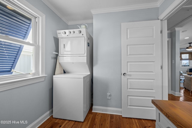 141 Bayview Blvd, Atlantic Beach, NC 28512 - laundry room featuring stacked washing machine and dryer, baseboards, ornamental molding, wood finished floors, and ceiling fan