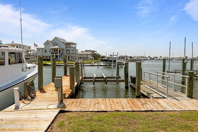 141 Bayview Blvd, Atlantic Beach, NC 28512 - dock area featuring boat lift and a water view