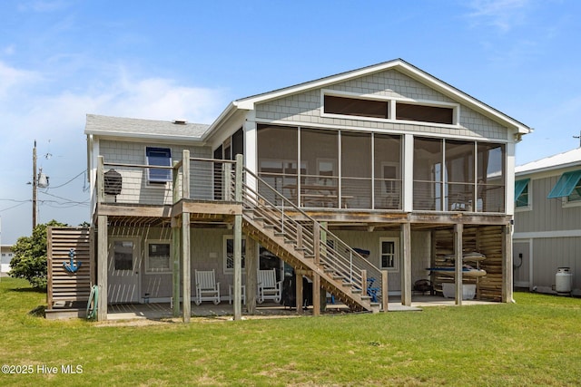 141 Bayview Blvd, Atlantic Beach, NC 28512 - rear view of house with stairs, a sunroom, a patio, and a yard