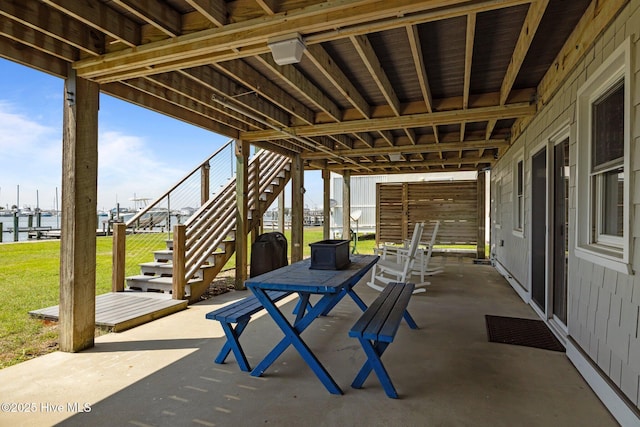 141 Bayview Blvd, Atlantic Beach, NC 28512 - view of patio featuring stairway and a water view