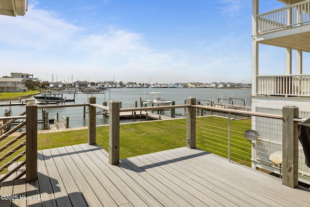 141 Bayview Blvd, Atlantic Beach, NC 28512 - wooden deck with a water view, a lawn, boat lift, and a dock