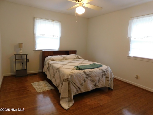 404 N Marlboro St, Mccoll, SC 29570 - bedroom featuring wood finished floors, baseboards, and ceiling fan