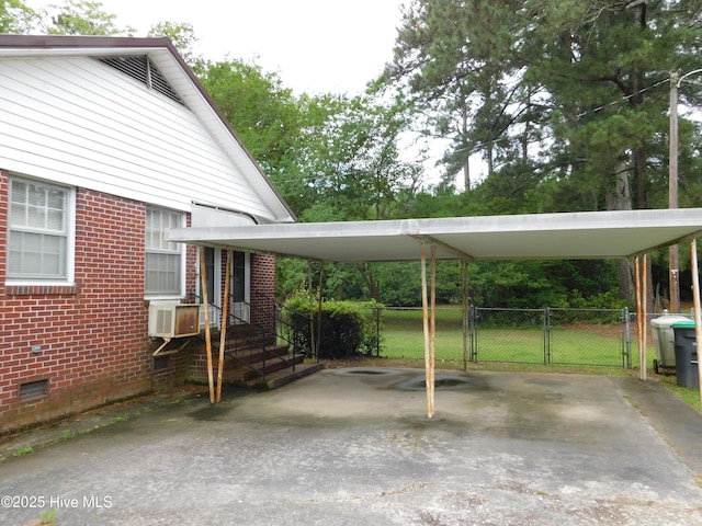 404 N Marlboro St, Mccoll, SC 29570 - view of vehicle parking featuring asphalt driveway, fence, and cooling unit
