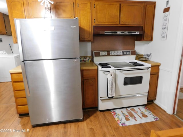 404 N Marlboro St, Mccoll, SC 29570 - kitchen featuring freestanding refrigerator, white electric range, under cabinet range hood, and light countertops