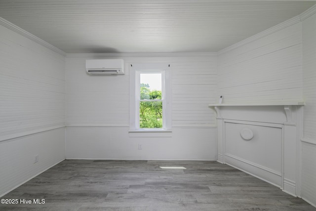 808 Green St, New Bern, NC 28560 - unfurnished living room with a wall mounted air conditioner, ornamental molding, and wood finished floors
