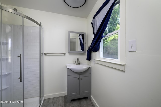 808 Green St, New Bern, NC 28560 - full bath featuring wood finished floors, healthy amount of natural light, a stall shower, and vanity