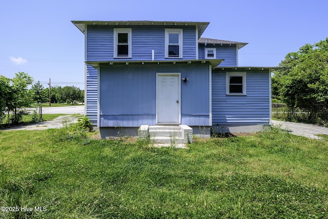 808 Green St, New Bern, NC 28560 - rear view of property with entry steps and a lawn
