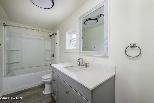 808 Green St, New Bern, NC 28560 - bathroom with wood finished floors, vanity, toilet, shower / bath combination, and ornamental molding