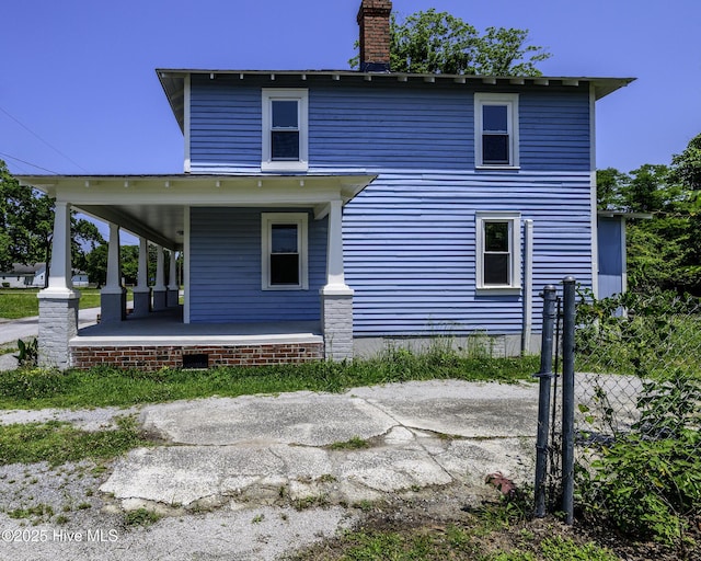 808 Green St, New Bern, NC 28560 - rear view of house featuring a porch and a chimney