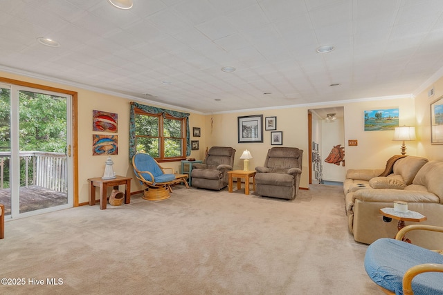 living area with ornamental molding, carpet floors, plenty of natural light, recessed lighting, and baseboards