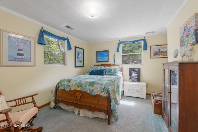 bedroom with carpet, crown molding, and baseboards