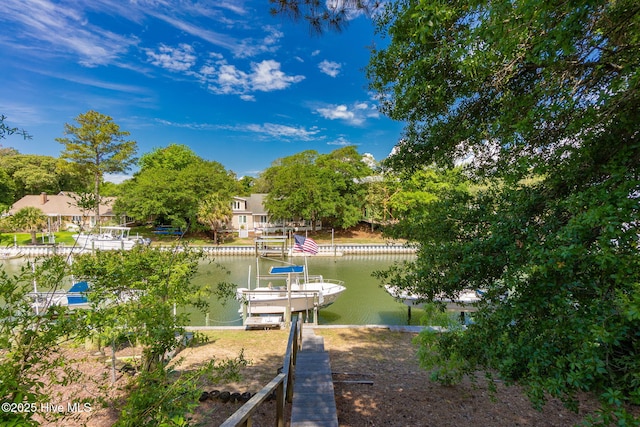 dock area featuring a water view and boat lift