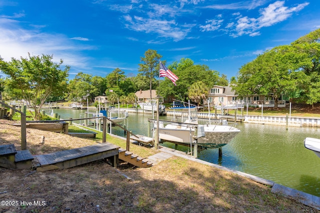 dock area featuring boat lift and a water view