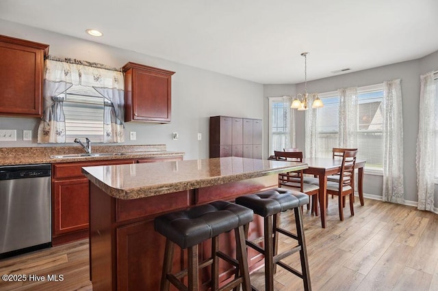 312 Hughes Ln, Jacksonville, NC 28546 - kitchen featuring stainless steel dishwasher, a sink, a chandelier, light wood finished floors, and recessed lighting