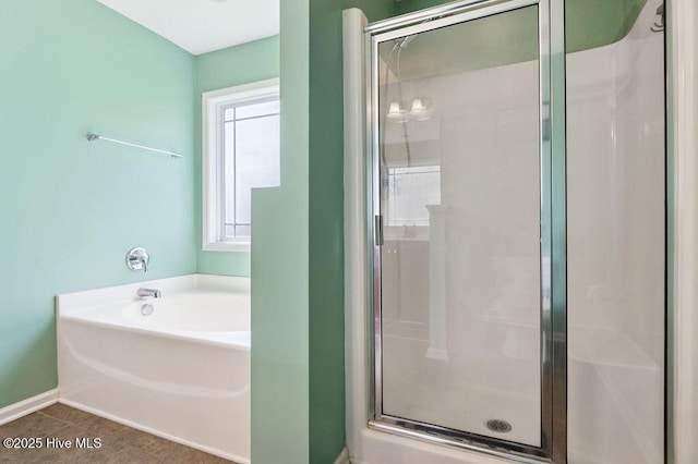 312 Hughes Ln, Jacksonville, NC 28546 - full bathroom with a shower stall, a bath, and tile patterned floors