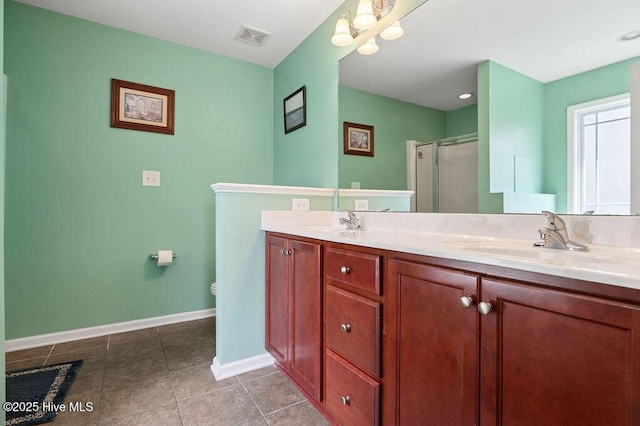 312 Hughes Ln, Jacksonville, NC 28546 - full bathroom featuring baseboards, a shower stall, double vanity, tile patterned floors, and toilet