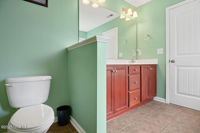 312 Hughes Ln, Jacksonville, NC 28546 - bathroom with toilet, tile patterned flooring, vanity, and baseboards