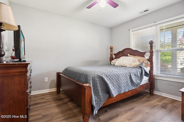 312 Hughes Ln, Jacksonville, NC 28546 - bedroom with baseboards, wood finished floors, and ceiling fan