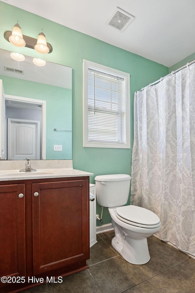 312 Hughes Ln, Jacksonville, NC 28546 - bathroom with vanity, toilet, tile patterned floors, and baseboards