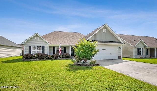 312 Hughes Ln, Jacksonville, NC 28546 - single story home featuring board and batten siding, a garage, concrete driveway, and a front yard