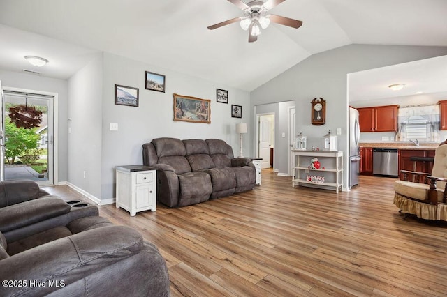 312 Hughes Ln, Jacksonville, NC 28546 - living area featuring vaulted ceiling, a ceiling fan, wood finished floors, and baseboards