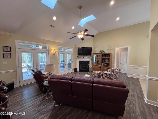 201 Shreveport Ct, Havelock, NC 28532 - living room with a skylight, french doors, dark wood-style floors, a ceiling fan, and high vaulted ceiling