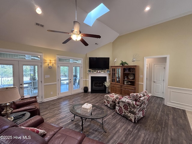 201 Shreveport Ct, Havelock, NC 28532 - living area featuring french doors, vaulted ceiling, dark wood-style flooring, a ceiling fan, and wainscoting
