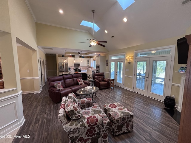 201 Shreveport Ct, Havelock, NC 28532 - living room with dark wood-type flooring, a skylight, french doors, crown molding, and high vaulted ceiling